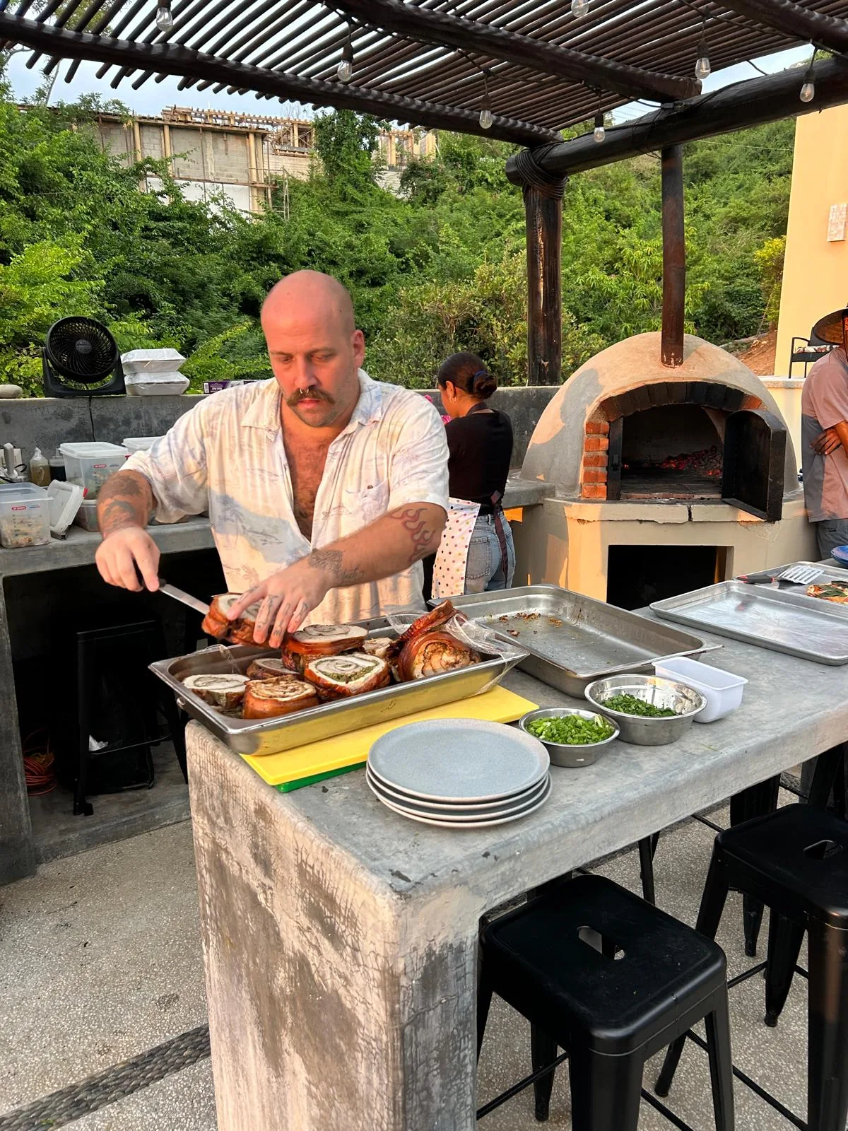 Chef cooking outdoors for a private gathering