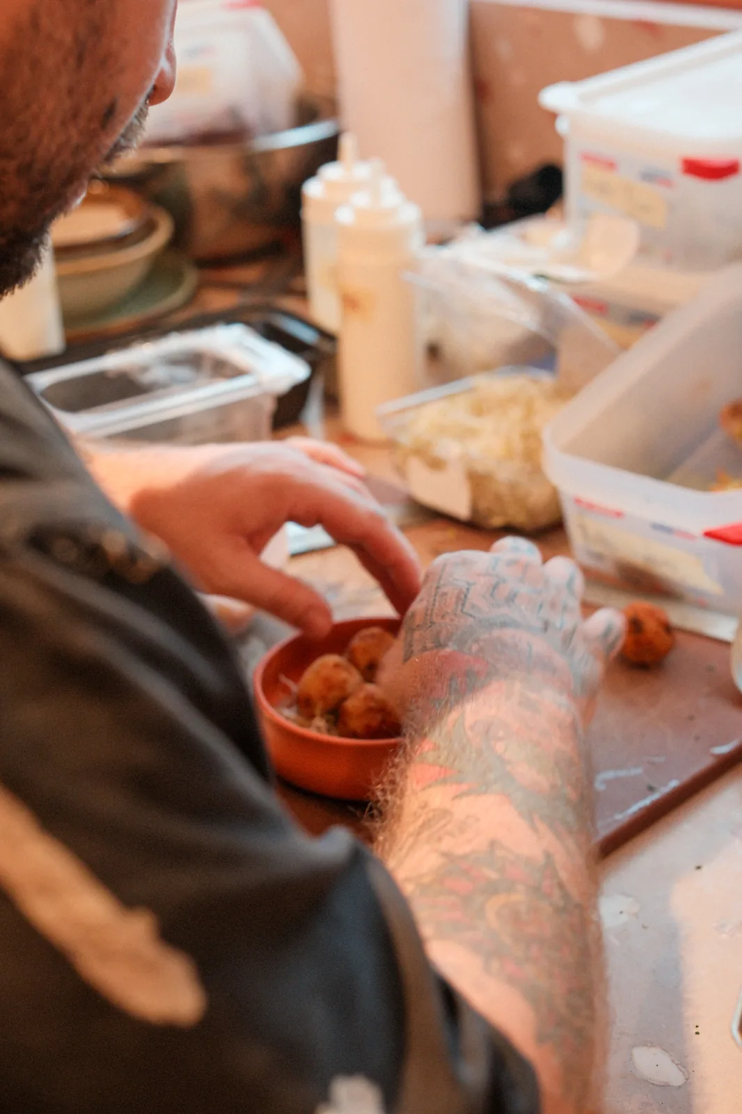 Chef assembling a fresh dish for guests