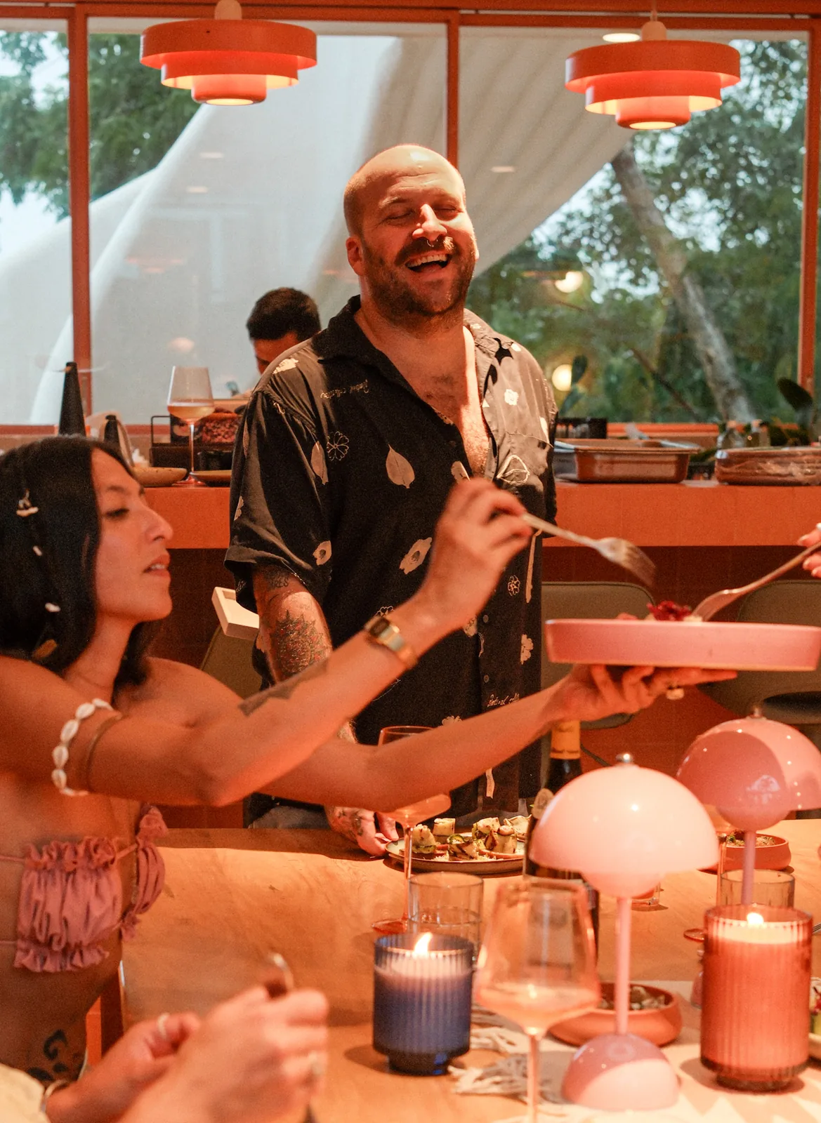 Chef presenting a dish to guests at their table