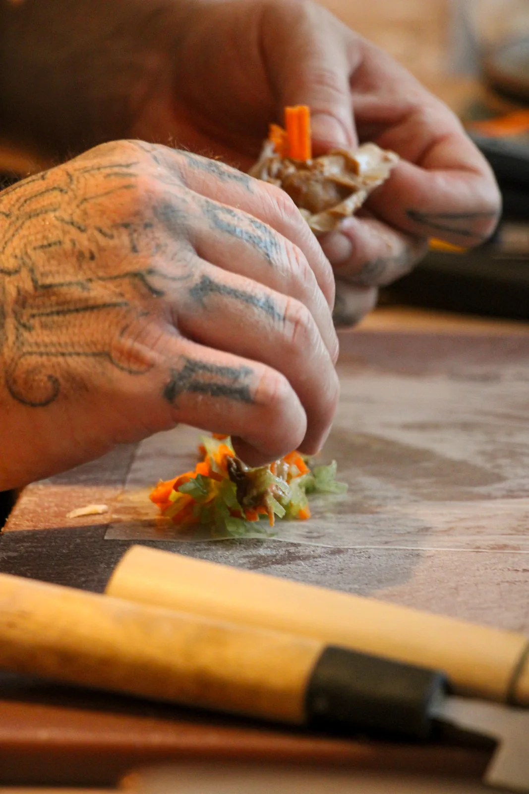 Chef preparing a delicate bite by hand