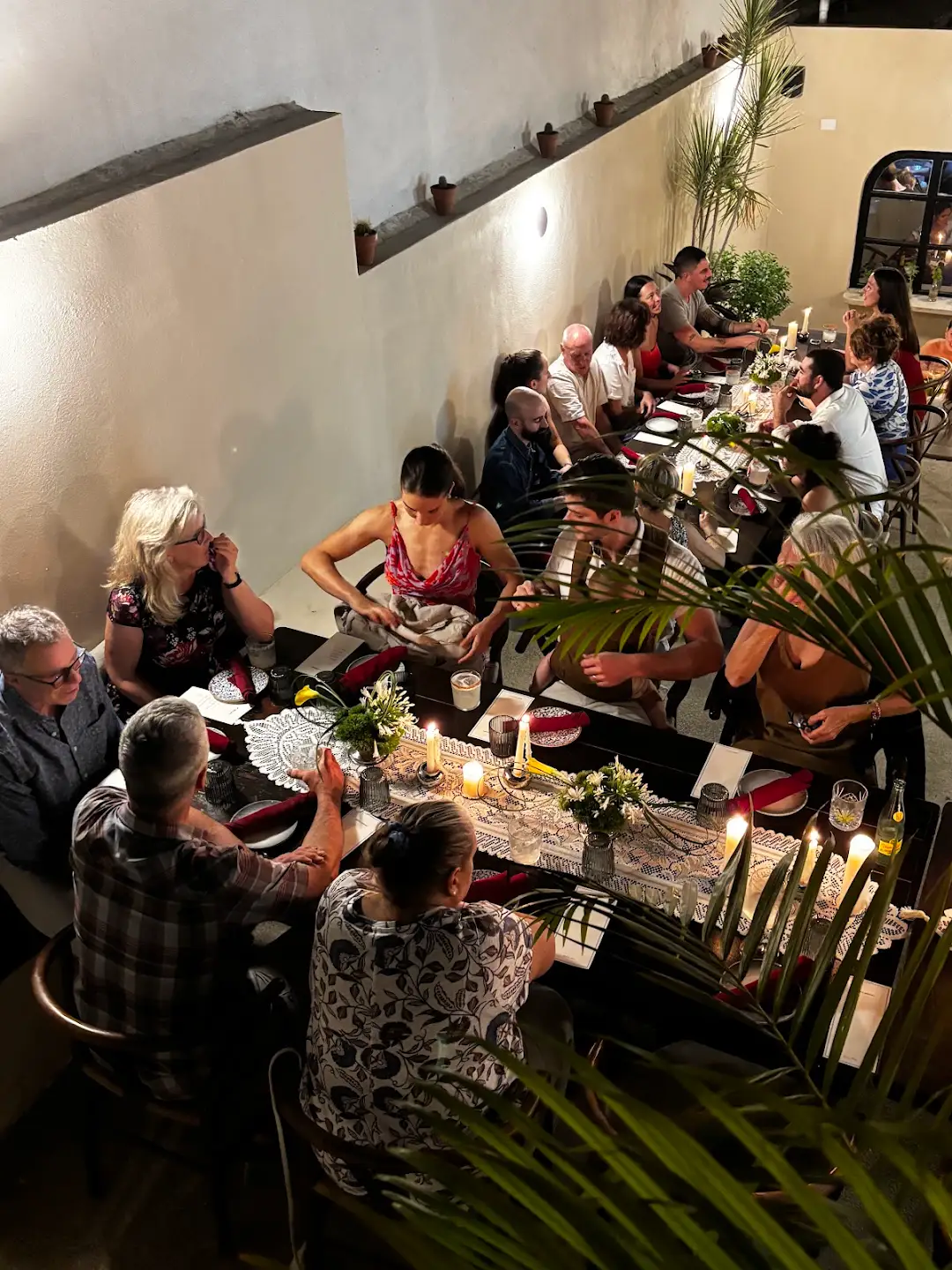 Guests sharing a long-table dinner at Habibi in San Pancho